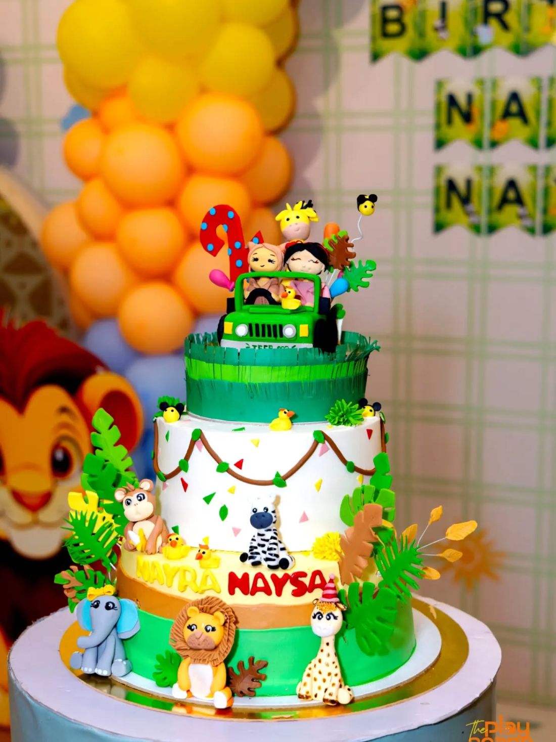 Three-tier jungle theme cake