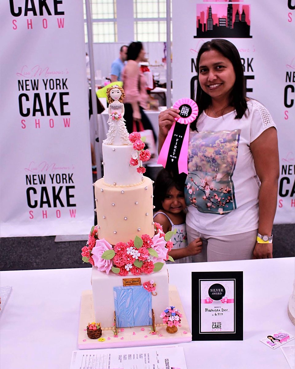 Madhulika Dev with her award-winning cake in New York